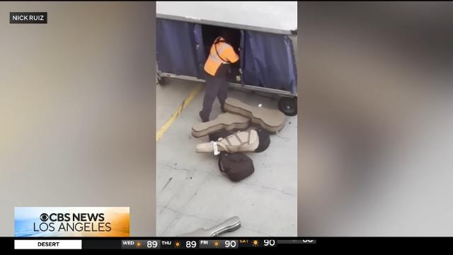 CBS-LA-LAX-worker-caught-tossing-musical-instruments-onto-tarmac-JhUcLetJiPM-896x504-1m43s